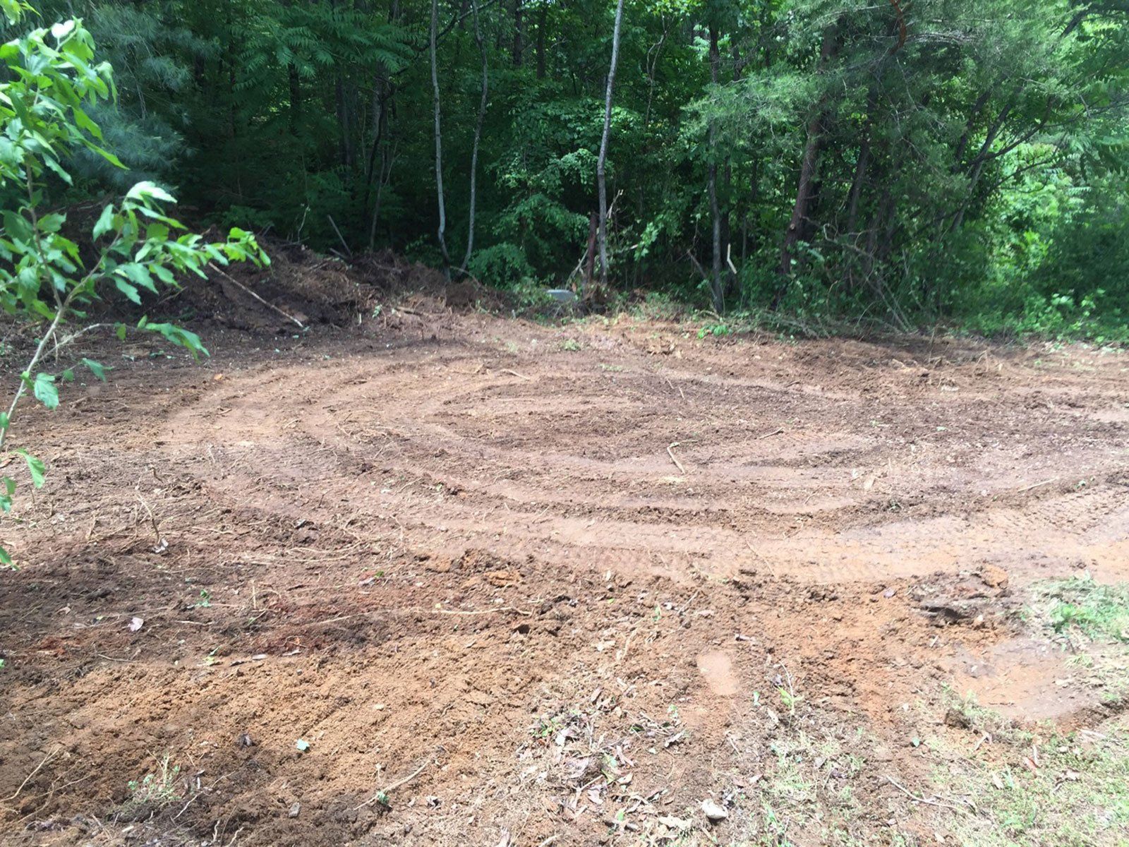 Land Being Levelled and Cleared by Yellow Earth Moving Digger — Salem, NH — Aspen Tree Service